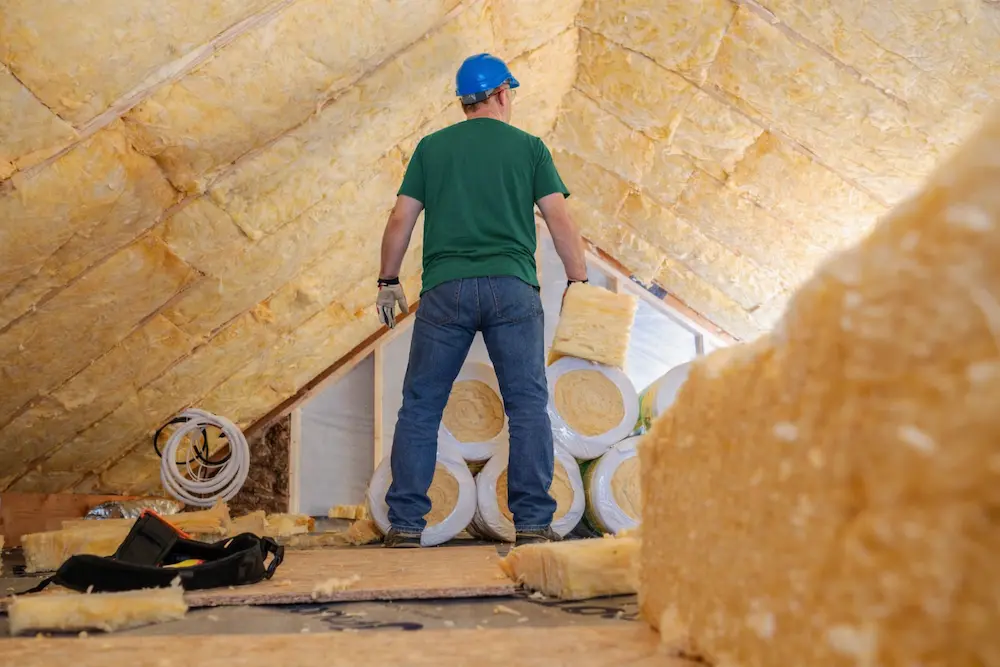 Spray foam or blown insulation being installed for improved indoor comfort and lower energy bills in Hollywood FL
